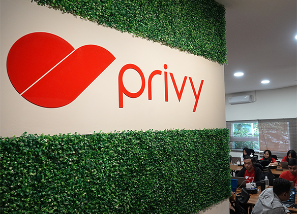 Privy logo on company wall | Privy AU