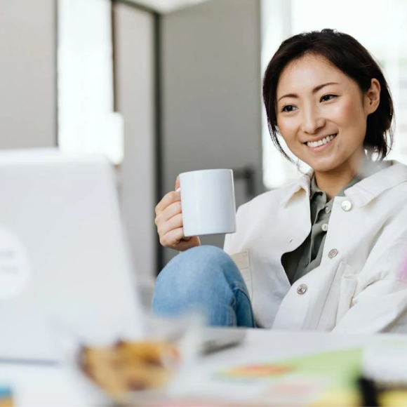 Woman enjoying coffee securing her digital identity with Privy | Privy AU