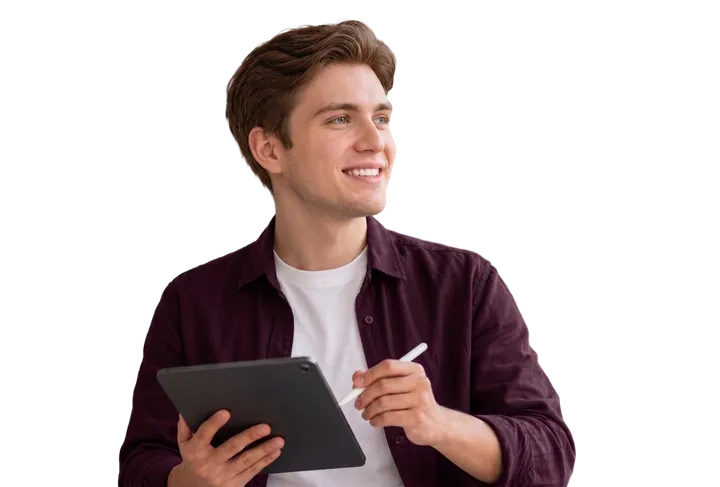 A smiling man holding a tablet and stylus