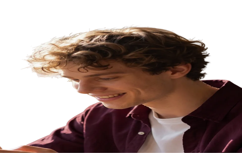 A young man smiling at his phone in a café, framed by identity-scan corner brackets
