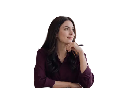 A smiling woman resting her chin on her hand